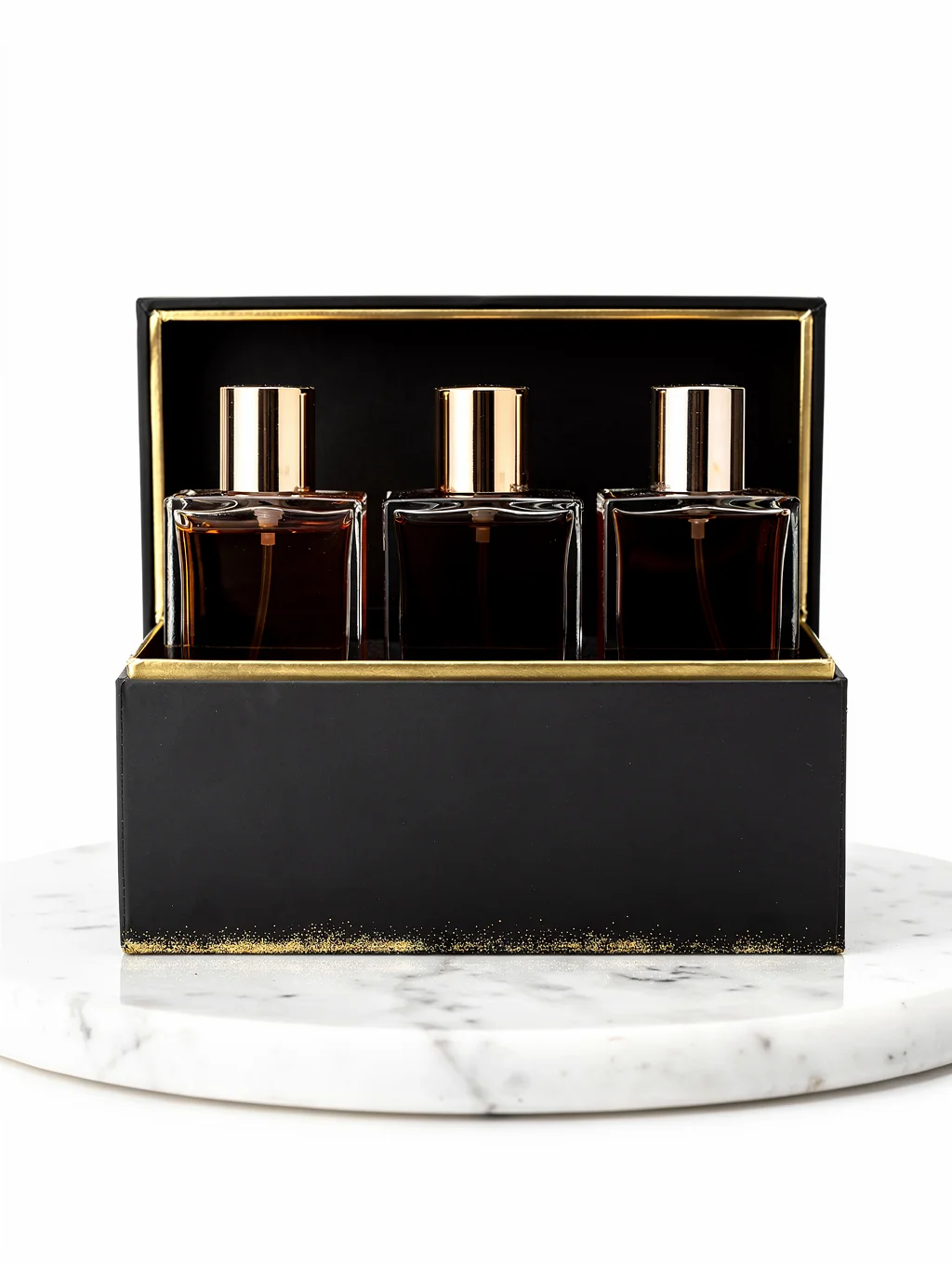 Premium perfume rigid box with gold foil accents on a dark display surface